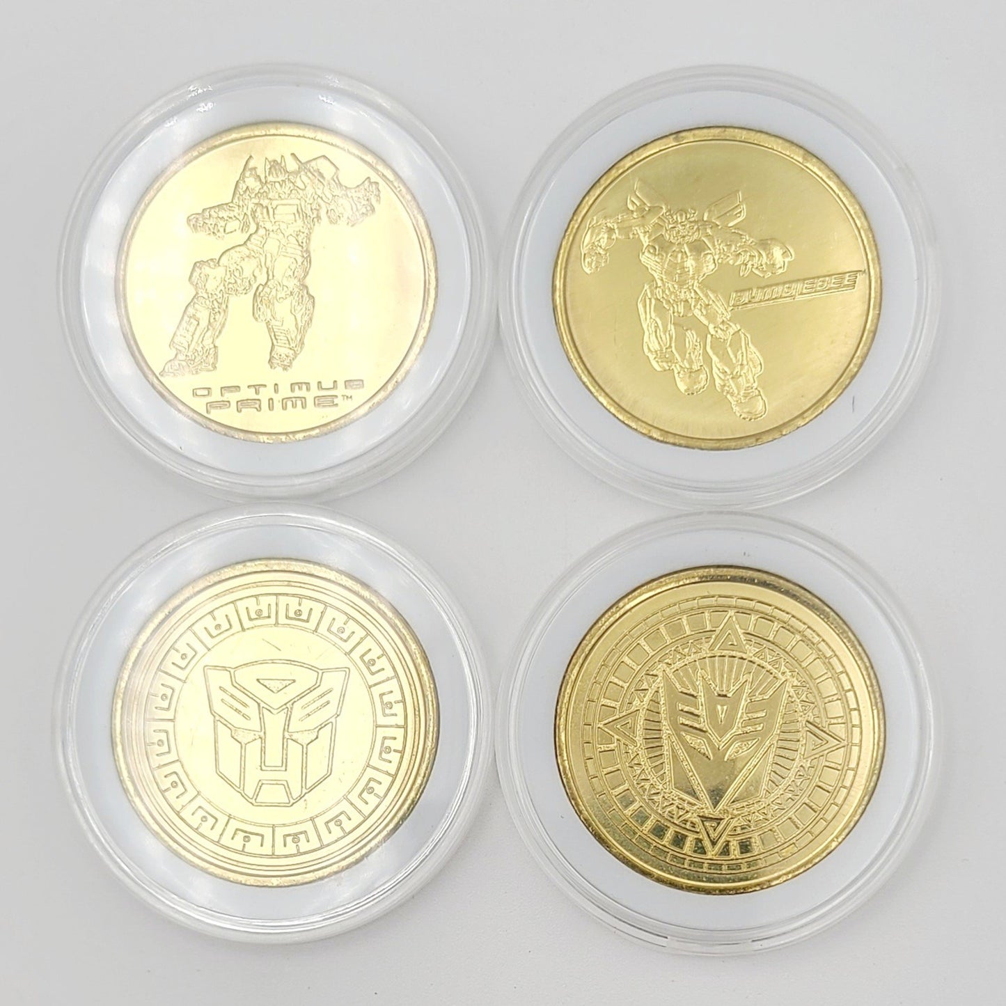 Set Of 4 Transformers Coin Medallion Bumblebee Optimus Prime Universal Studios