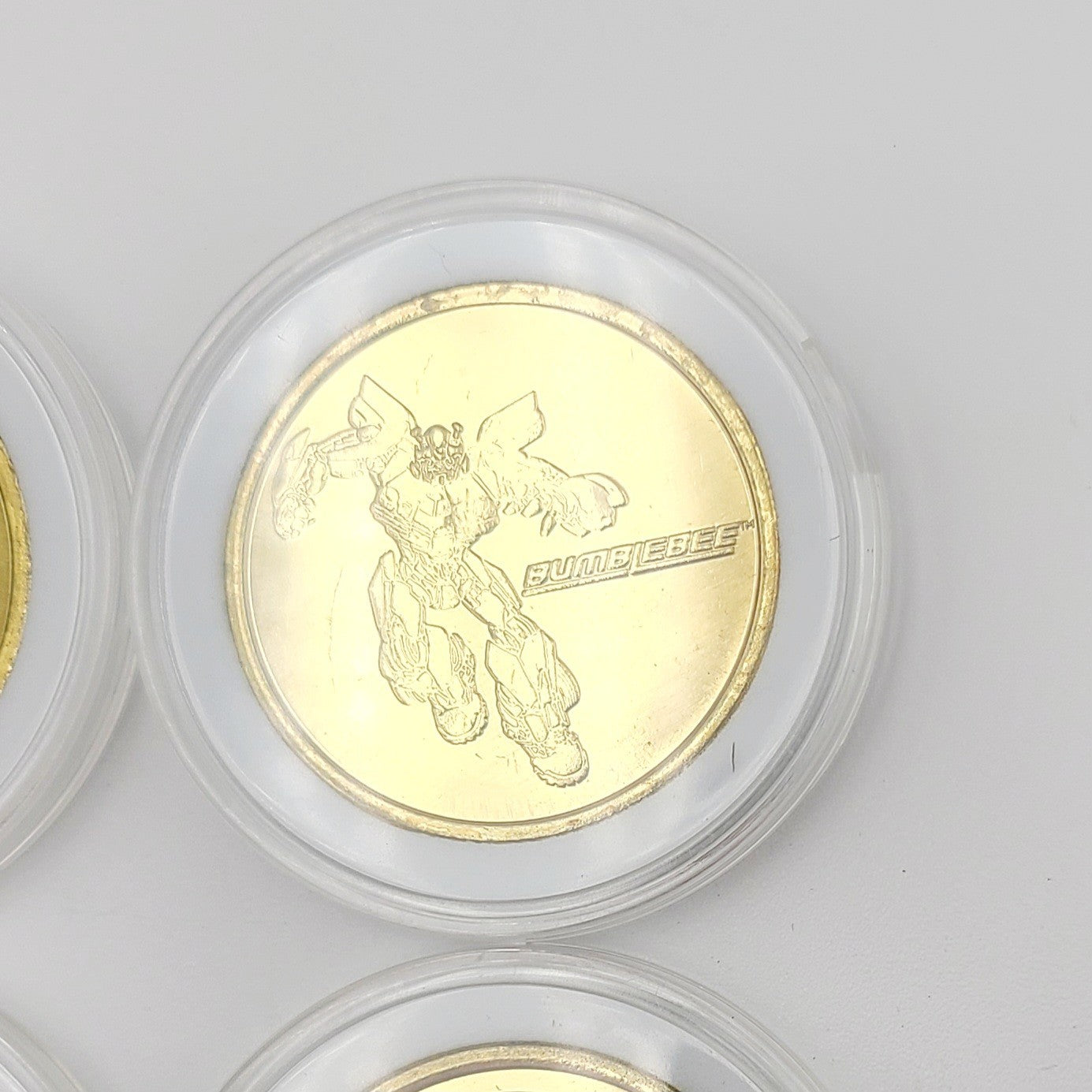 Set Of 4 Transformers Coin Medallion Bumblebee Optimus Prime Universal Studios