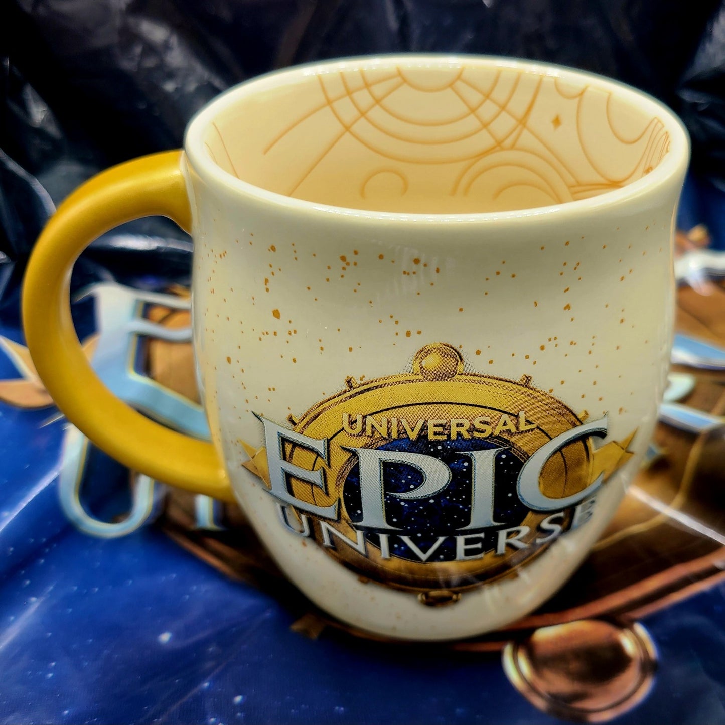 EPIC Universe Universal Studios Logo Emblem Ivory Coffee Mug Cup Gold Handle NEW
