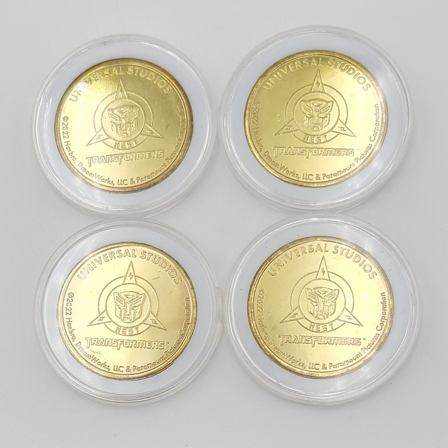 Set Of 4 Transformers Coin Medallion Bumblebee Optimus Prime Universal Studios