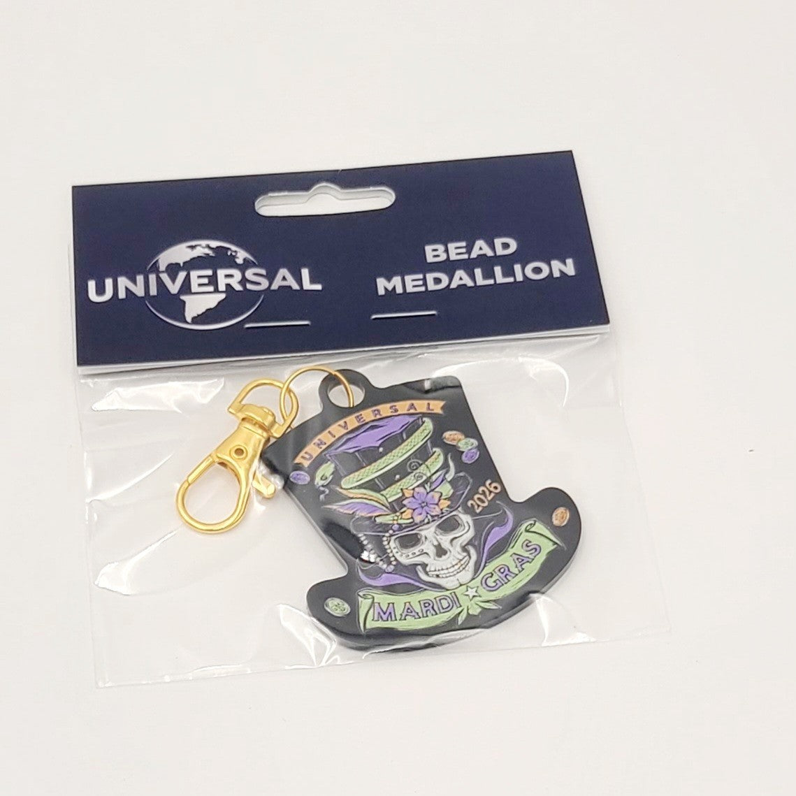 2026 Universal Studios Mardi Gras Bead Medallion Keychain Party Like A Baron NEW