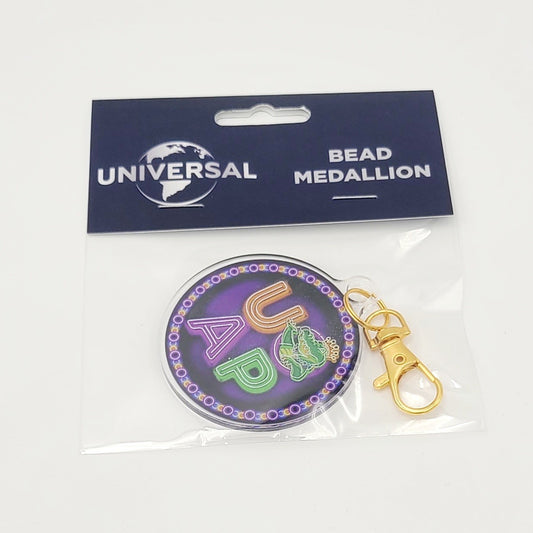 2026 UOAP Universal Studios Park Mardi Gras Bead Medallion King Gator Keychain